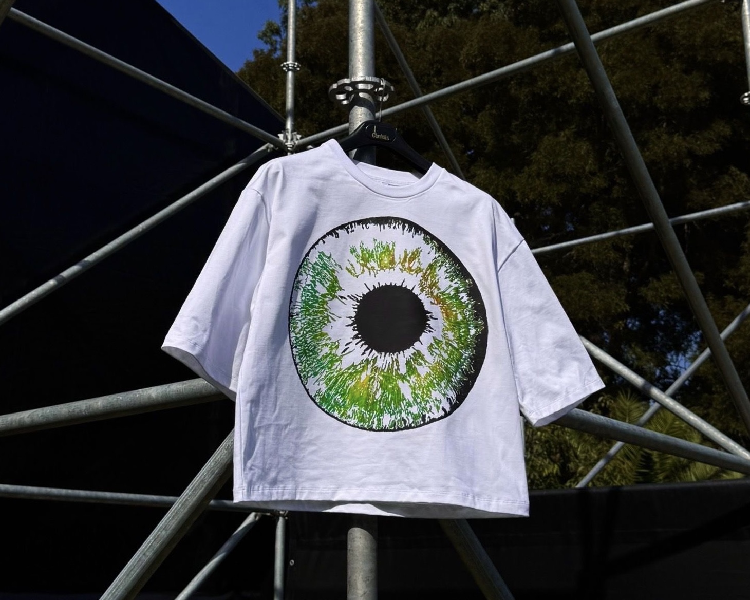White oversized t-shirt with green eye graphic print